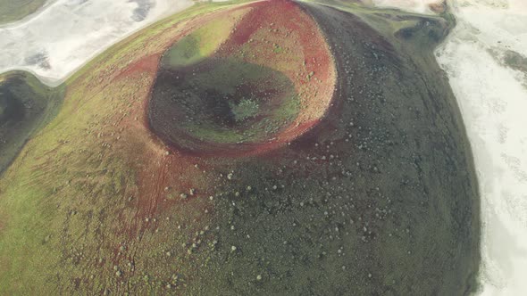 Dried caldera lake among bigger lake from air