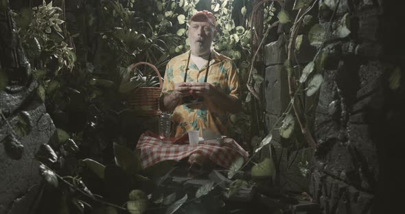 Tourist leaving garbage in the forest