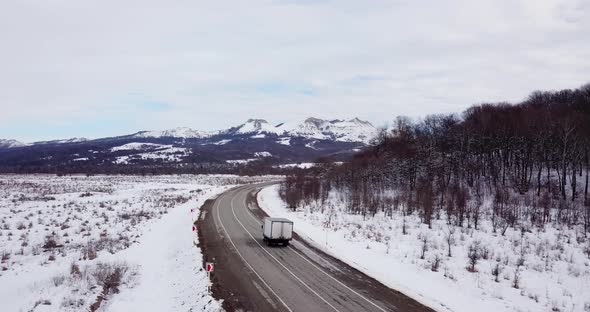 Aerial View Deep Winter Rural Country Landscape Flying Over Along Deserted Road alt