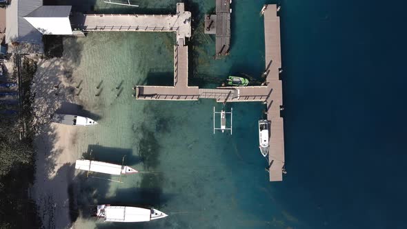 Abandoned dock pier on Gili Island in Indonesia during covid19 pandemic lockdown.Aerial top down vie alt