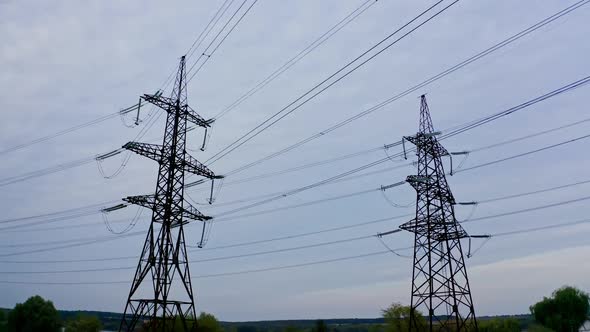Voltage electric transmission tower. High voltage lines and power pylons alt