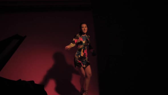 Fashionable Sexy Woman Model of Asian Appearance in a Business Pink Suit alt