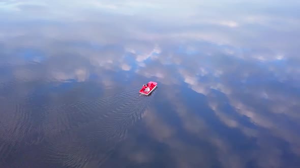 Family on a Pedal Boat on a Lake Drone Footage.