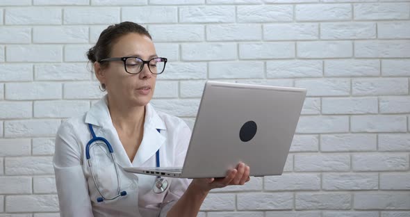 Video call with professional doctor.  alt