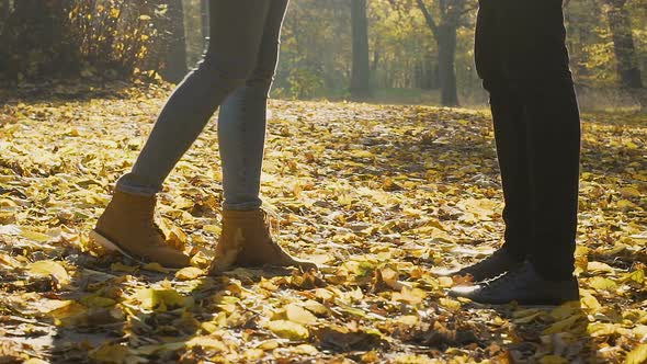 Female Feet Approaching Man And Stand On Tiptoes To Kiss Romantic Date