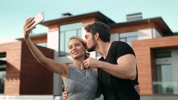 Beautiful Couple Taking Selfie with House Keys Outside Residence alt