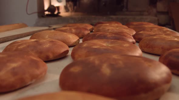 Bread making in a stone oven. alt