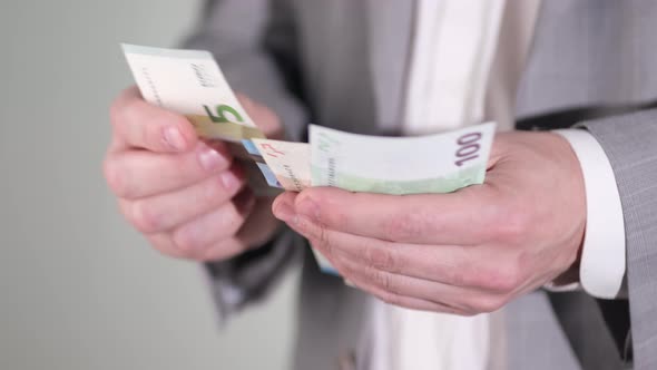 Hands counting EUR bills or paying in cash on money background. 4k