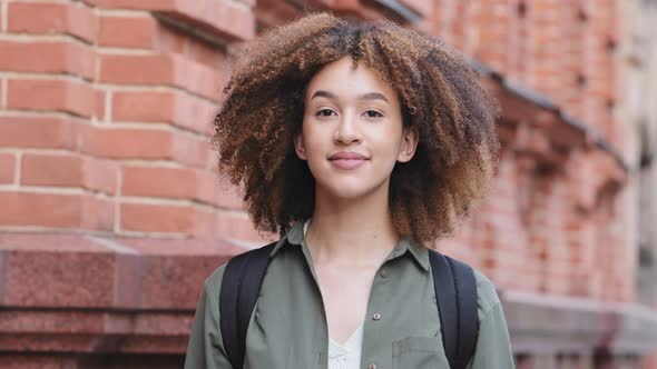 Head Shot Smiling Beautiful Young African Woman Taking Off Protective Facial Medical Mask Deeply alt