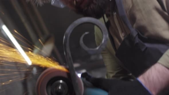 Blacksmith Using Polishing Machine alt
