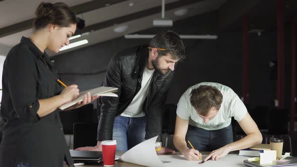 Young Architects Working on a Project Drawing and Thinking in Modern Office alt