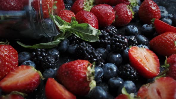 Wild Forest Berries on Black Background, Collection of Strawberry, Blueberry and Blackberry. alt