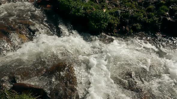 Glacial Mountain River Flows Down