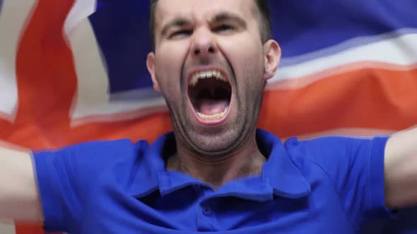Icelandic Fan Celebrates Holding the Flag of Iceland alt