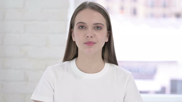 Portrait of Beautiful Young Woman Saying No By Finger Gesture alt