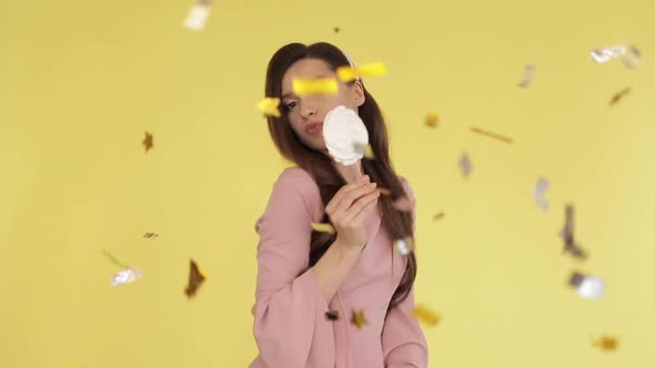 Beautiful Brunette Girl in Pink Dress Dancing with Candies Under Confetti alt