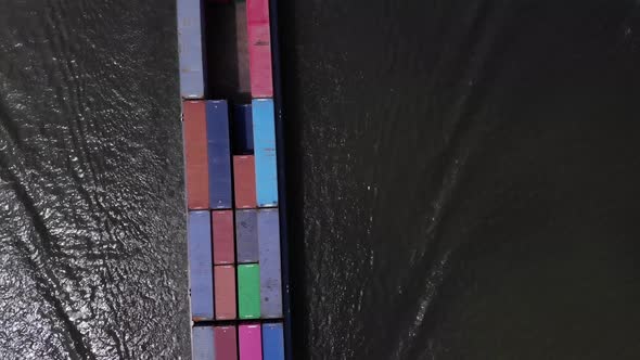 big container barge captured from above alt