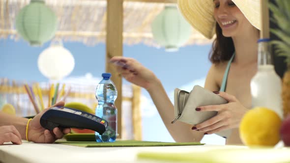 Woman paying with a contactless credit card