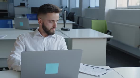 Hard Work of Young Man in an Office Company alt