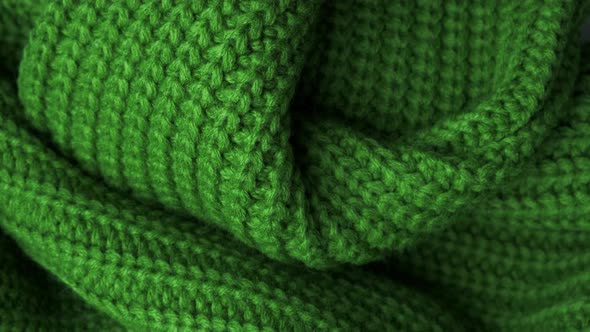 The Texture of the Fabric. Green Knitted Texture. Close-up. Can Be Used As a Background. alt