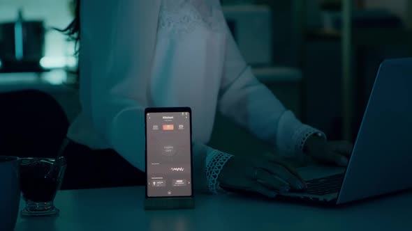 Woman Using Voice Assistant Controlling Light Turning It on alt