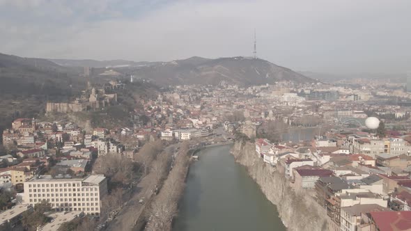 Aerial view of Metekhi church in old Tbilisi located on cliff near river Kura. Georgia 2021 winter alt