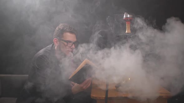 Guy Smokes Hookah alt