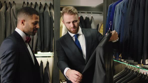 In the Luxury Suit Shop Man Groom Try to Choose
