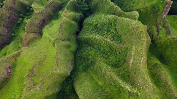 Cinematic Top Down Aerial Over Green Mountain Peaks  Scenic Nature Footage alt