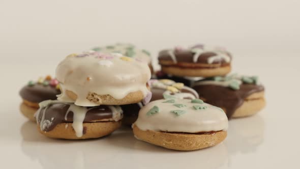 Tasty teacakes on pile slow tilt 4K 2160p 30fps UltraHD footage - Glazed and stuffed cookies with sp alt