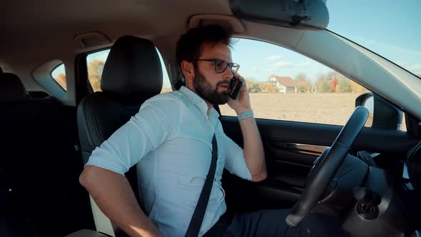 Driver Fastening Seatbelt In Car.Businessman In Car.Seatbelt.Man Fastening Car Safety Seat Belt. alt