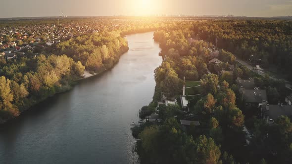 Sunrise Over Cottages at River Shore Aerial alt