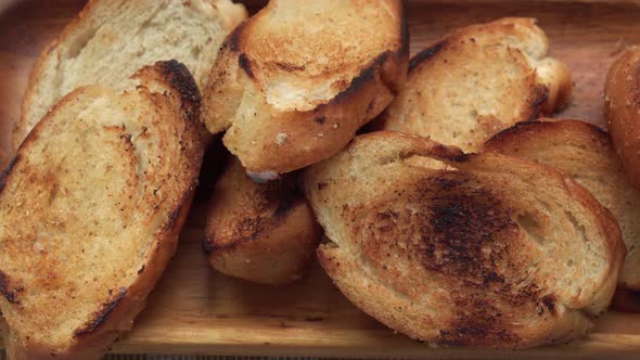 Fried Croutons are on a Plate Closeup Top View alt