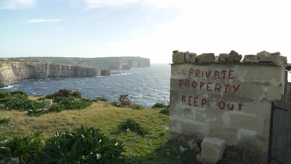 Stone Shed near Mediterranean Sea with Private Property Keep Out Written on the Wall