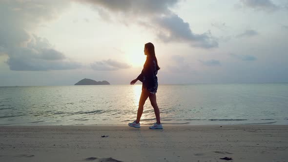 Cute Asian Girl in Kimono Walking on a Beach at Sunset in Slow Motion Thailand