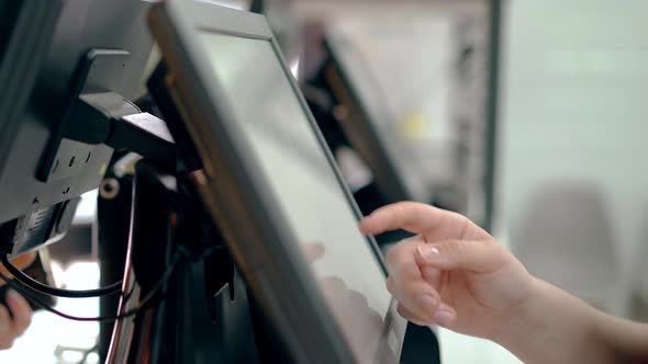 Cashiers Are Working Touching the Touch Screen Choosing the Right Products alt