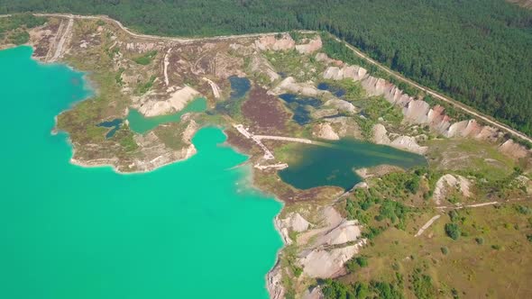 An artificial lake in chalk quarry. view from drone. Turquoise water background alt