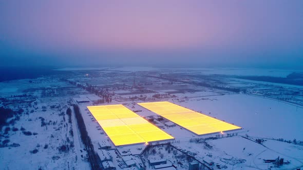 Aerial Side View of Large Industrial Greenhouses for Growing Plants in Winter