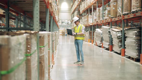 Warehouse Employee is Doing Inventory on the Premises alt