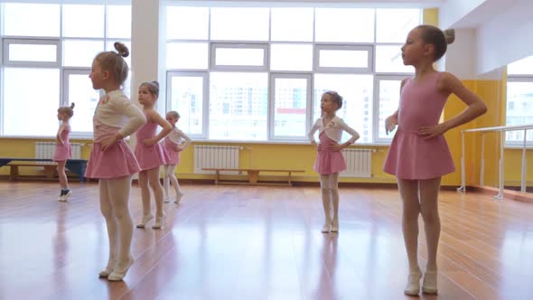 Group of little girls practicing in ballet school