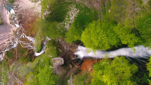 Birds Eye Shot of Kinchkha Waterfall and River on Okatse Canyon Vertical Aerial Video alt