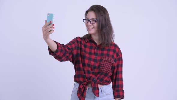 Happy Young Beautiful Hipster Woman Video Calling and Showing Phone alt