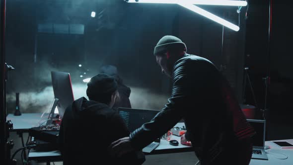 Hackers Committing Cybercrime in Dark Hideout alt