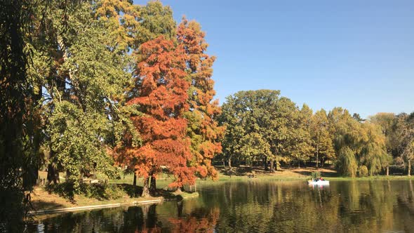 CRAIOVA, ROMANIA - OCTOBER 17, 2017 Beautiful day in the city park with people enjoying nice weather alt