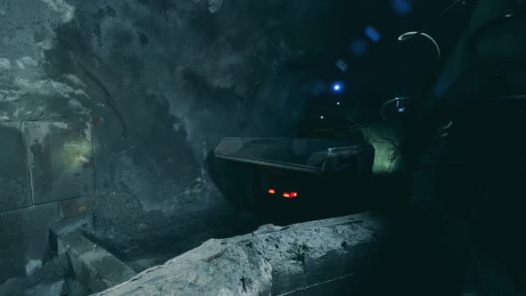 Minery Tunnel with a Truck Driving Through It alt