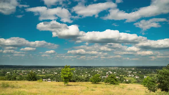 Landscape Fields and Moving Clouds in Blue Sky. Timelapse. Amazing Rural Valley. Ukraine alt