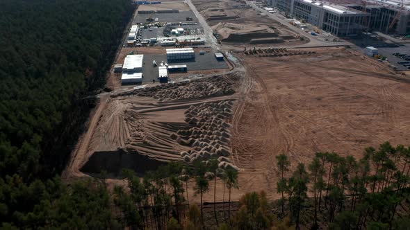 Establishing Shot of a Big Construction Site in Rural Area with Dirt and Sand for Building a Factory alt