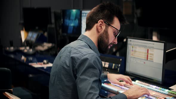 Operator On TV Channel Studio Room. Studio Director On Video Mixer Broadcast TV Station. Engineer TV alt