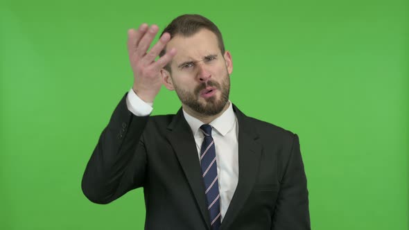 Frustrated Young Businessman Doing Shouting Against Chroma Key alt