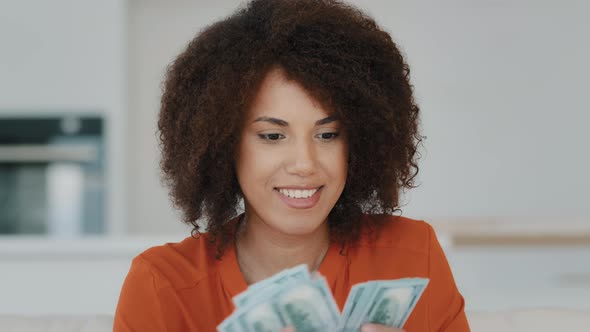 Portrait Indoors Wealthy Happy Smiling Exited Successful African American Woman Counting Dollar alt